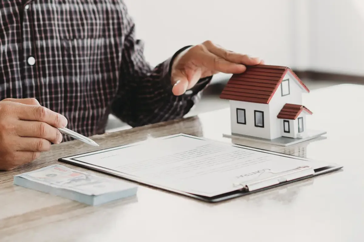 A property owner reviewing and signing an agreement with an advisor