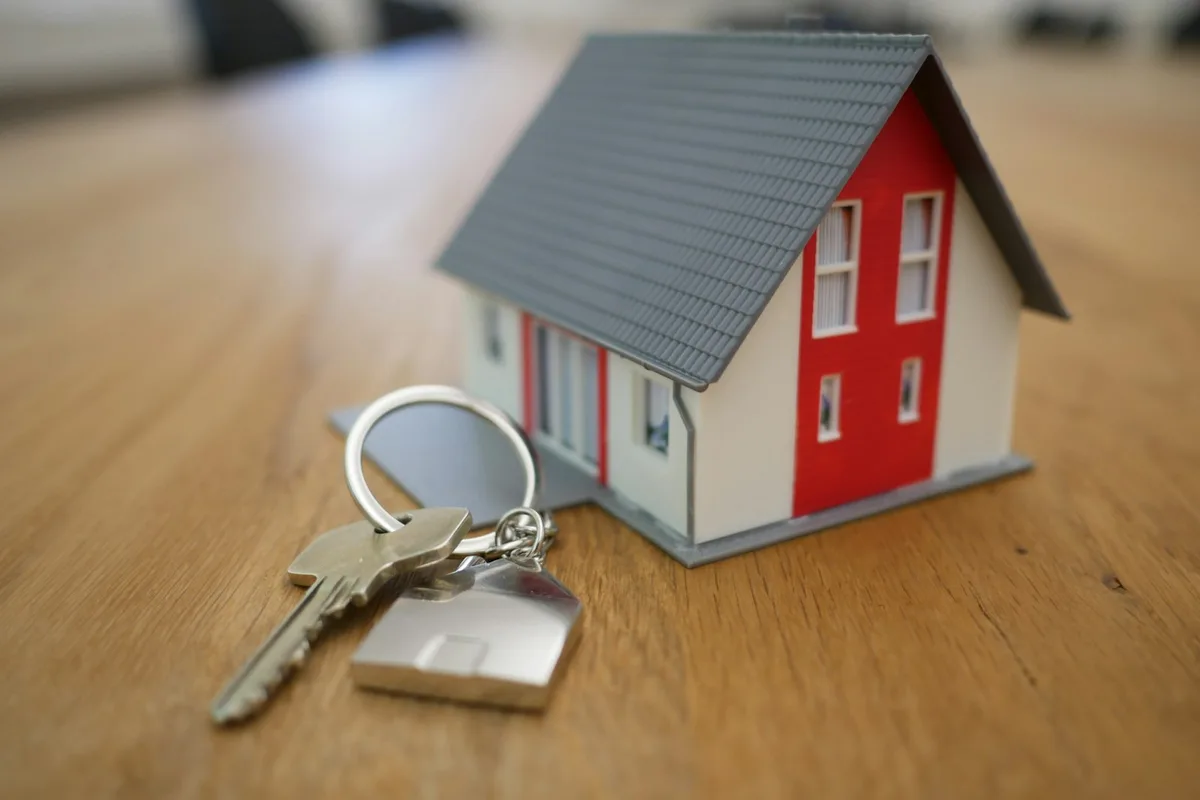 Keys to a managed rental property being handed over